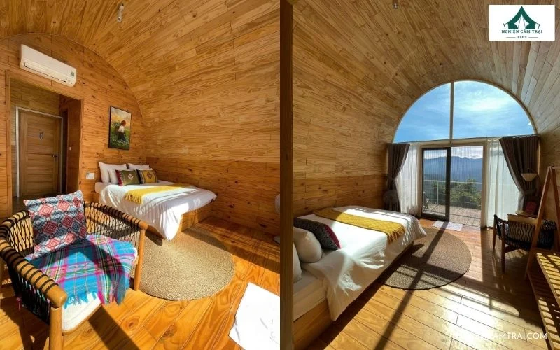 Nội thất phòng lều glamping ốp gỗ ấm cúng, sạch sẽ với giường nệm êm ái và cửa kính lớn hướng ra thung lũng tại PHANSI